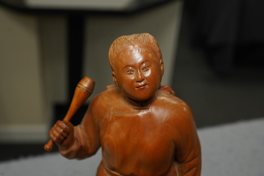 A Chinese boxwood figure of a female juggler, attributed to Zhu Zichang (1876-1934), Republic period